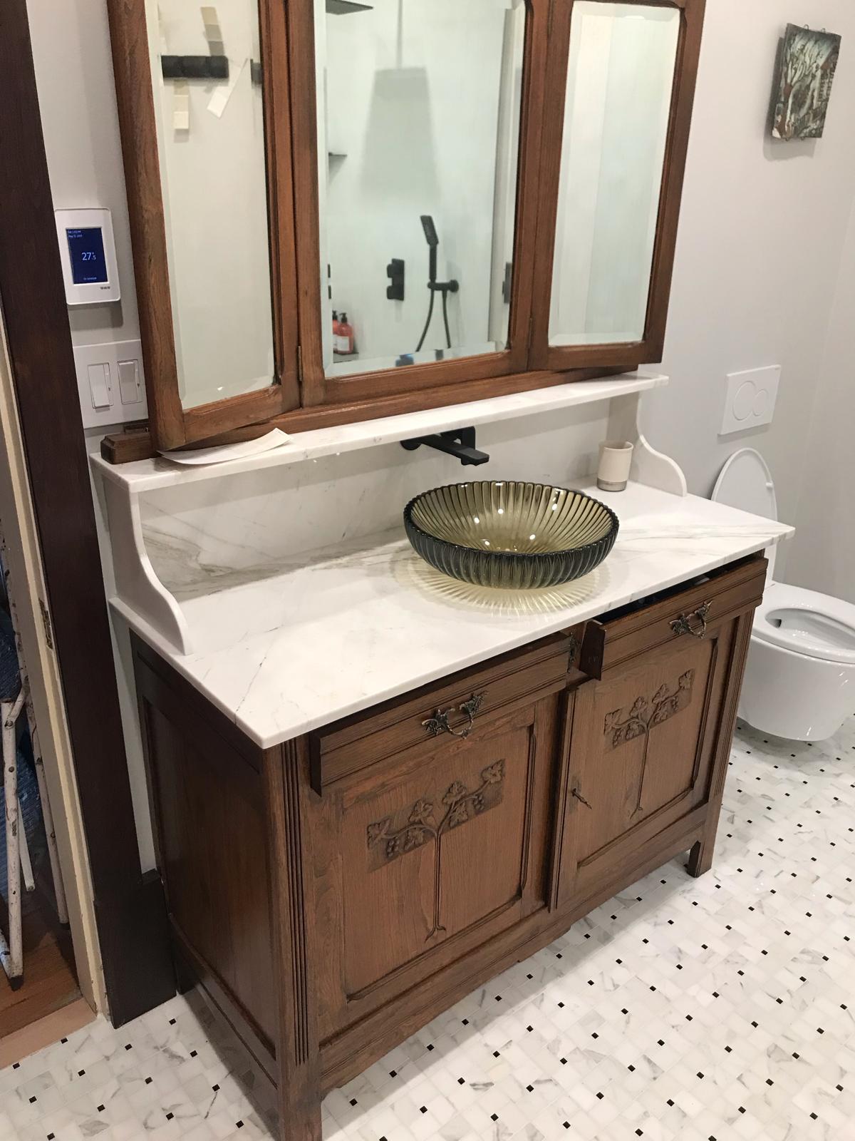 Vintage vanity mirror and vessel sink after Marble Heritage Vanity Restoration