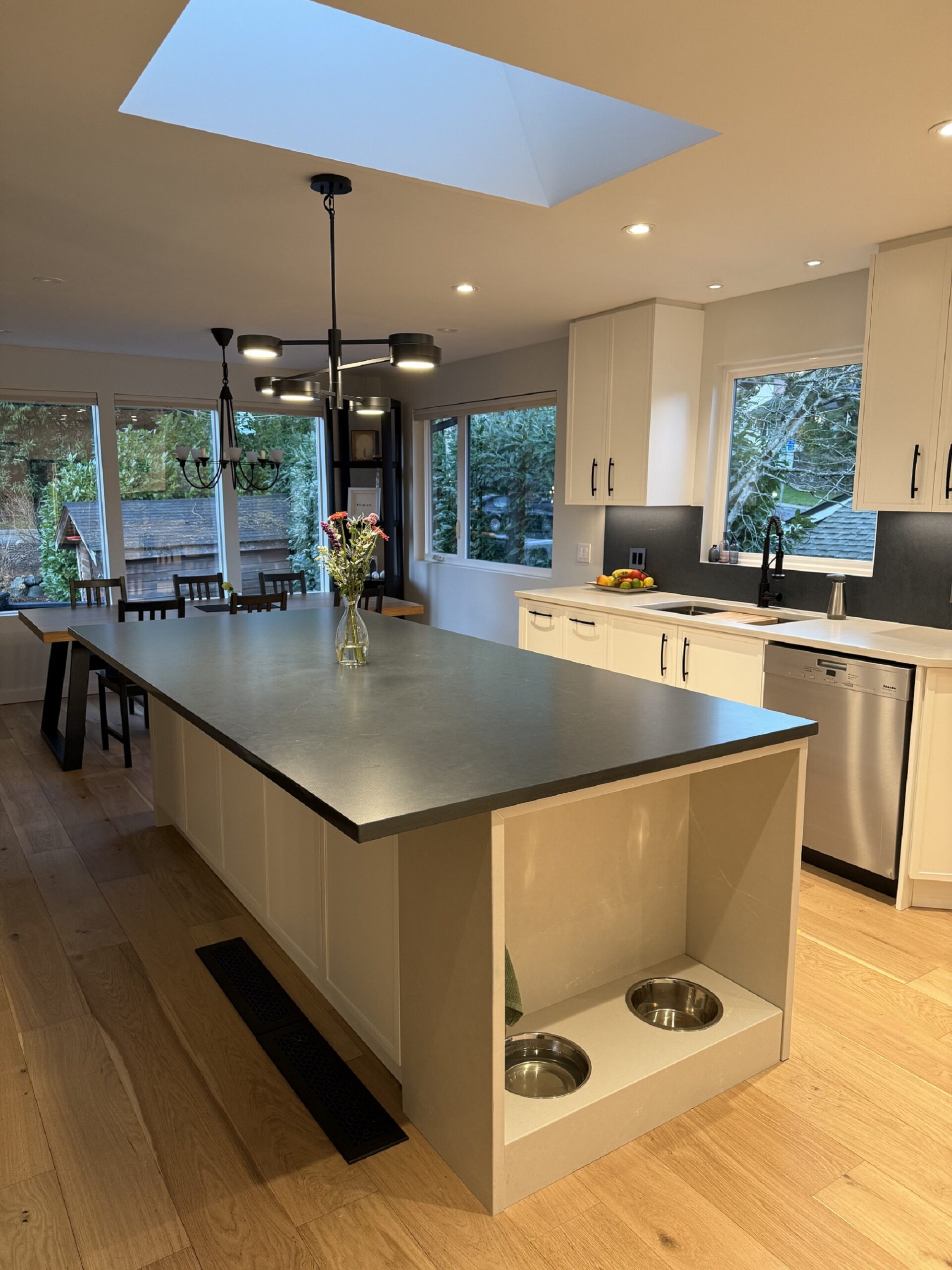 Quartz dog station built into Quartz Countertops North Vancouver cabinetry for a functional and stylish pet-friendly design.