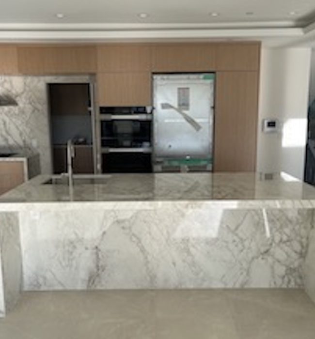 Custom-fabricated Dekton porcelain slab with waterfall edge
