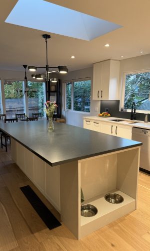 Quartz dog station built into Quartz Countertops North Vancouver cabinetry for a functional and stylish pet-friendly design.